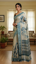 Woman wearing a floral saree in a living room setting